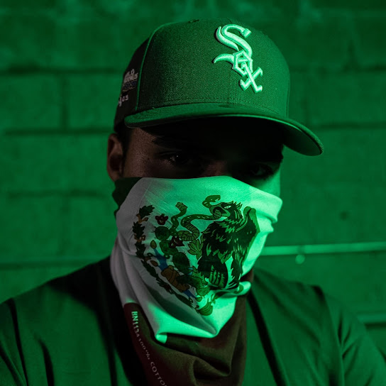 BIG SERB$ wearing a green cap and bandana
